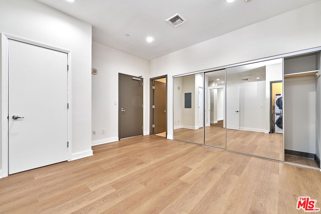 3810 Wilshire Boulevard, Unit 404 Los Angeles, CA 90010 - Photo 19 of 43 a view of empty room with wooden floor