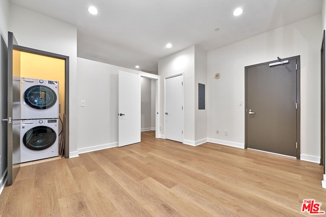 3810 Wilshire Boulevard, Unit 404 Los Angeles, CA 90010 - Photo 20 of 43 a view of a livingroom with washer and dryer