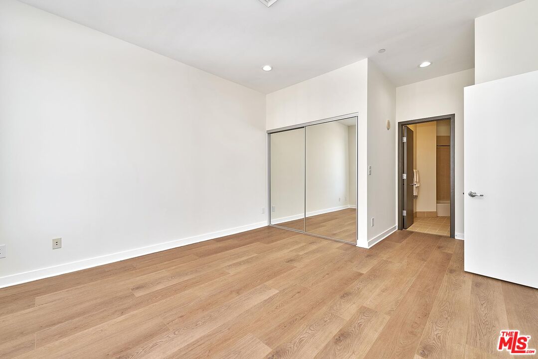 3810 Wilshire Boulevard, Unit 404 Los Angeles, CA 90010 - Photo 22 of 43 a view of an empty room with wooden floor