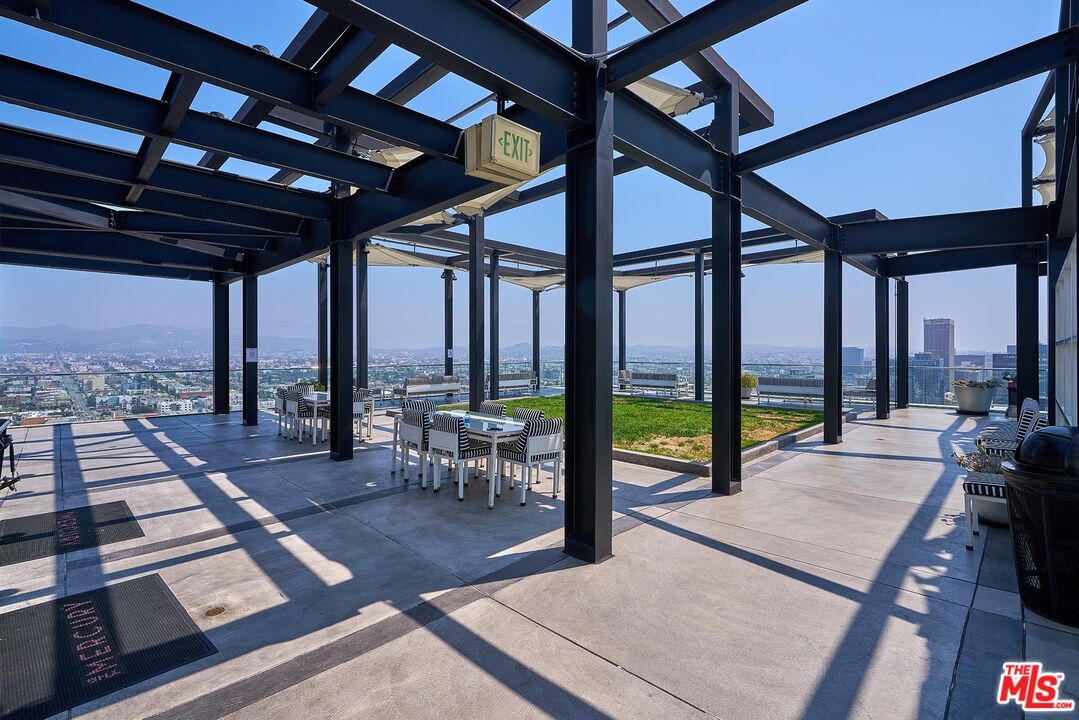3810 Wilshire Boulevard, Unit 404 Los Angeles, CA 90010 - Photo 36 of 43 a living room with large windows