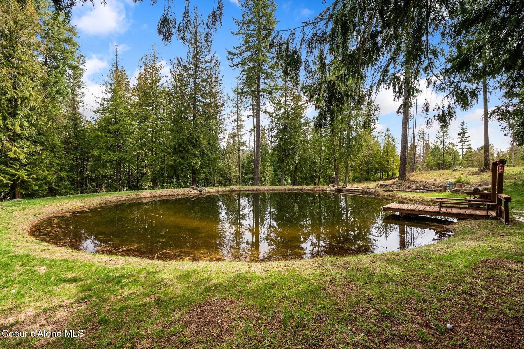 177 Hawkins Spur Road Sagle, ID 83860 - Photo 53 of 70 Swimming Pond wWaterfall & Dock