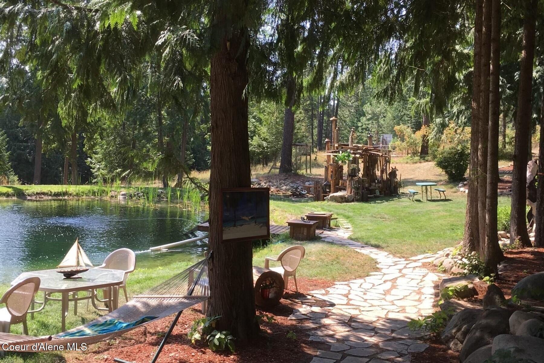 177 Hawkins Spur Road Sagle, ID 83860 - Photo 54 of 70 Swimming Pond wWaterfall & Dock