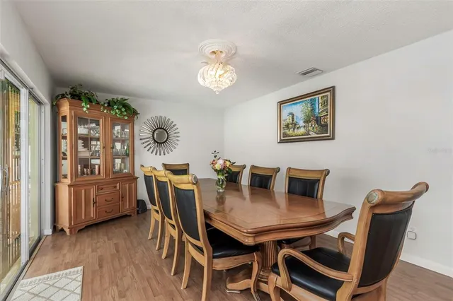 a kitchen with white cabinets sink and stainless steel appliances
