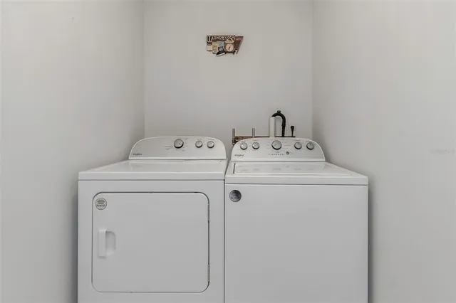 a bed room with a bed and a television