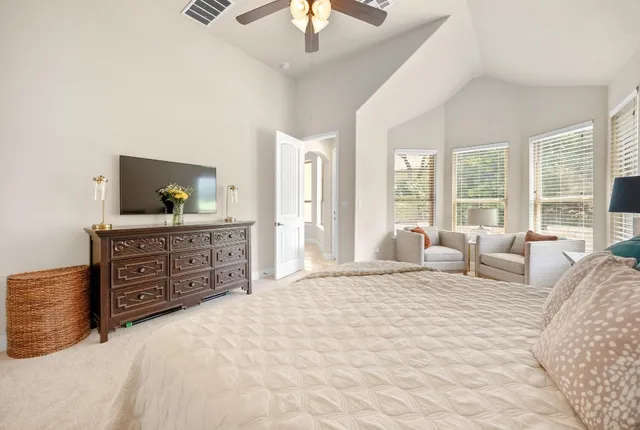 a bedroom with a bed and a dresser