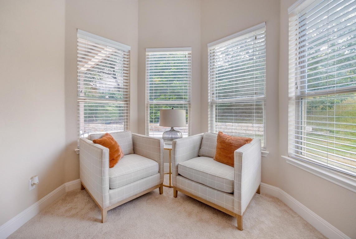 106 Tonkawa Trail West Austin, TX 78738 - Photo 18 of 39 a living room with furniture and a large window