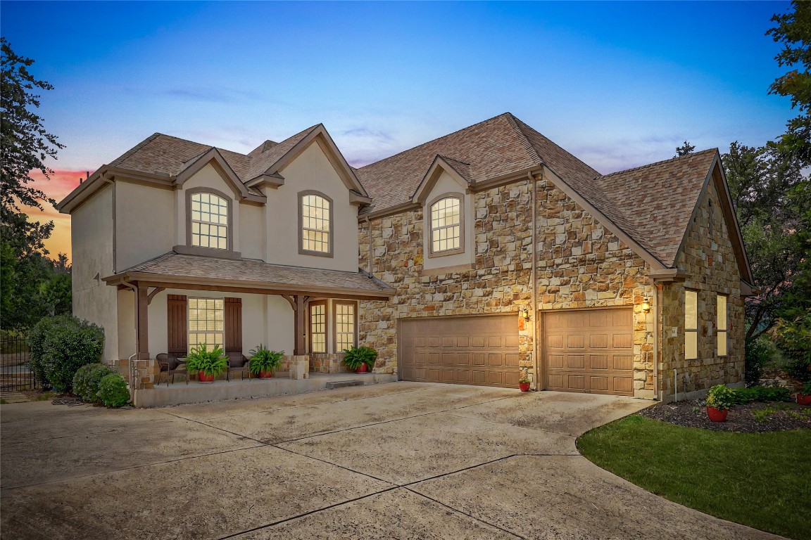 106 Tonkawa Trail West Austin, TX 78738 - Photo 4 of 39 front view of a house with a yard