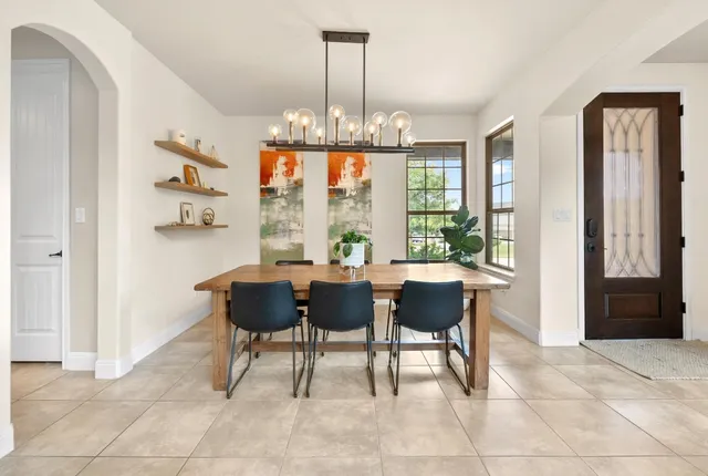 a view of a dining room with furniture window and outside view