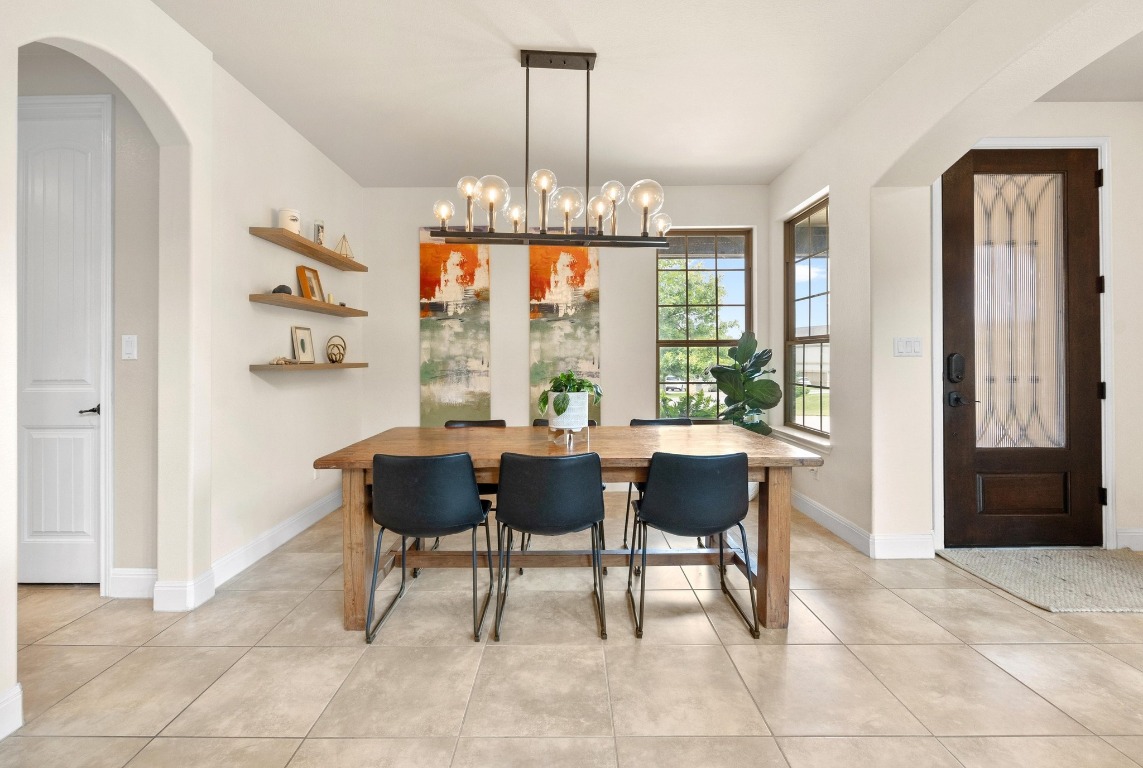 106 Tonkawa Trail West Austin, TX 78738 - Photo 9 of 39 a view of a dining room with furniture window and outside view
