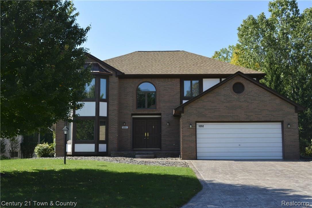 5 bedroom home with brick and wood exterior
