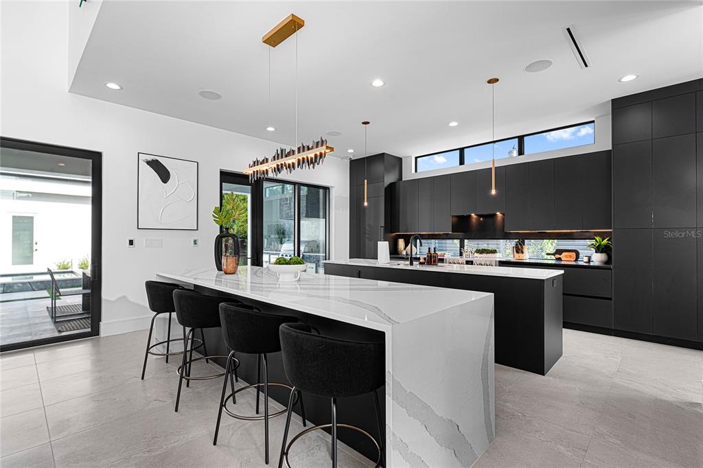 2519 North Riverside Drive Tampa, FL 33602 - Photo 14 of 34 a large kitchen with a table and chairs in it