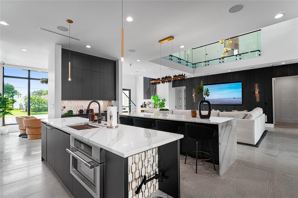 2519 North Riverside Drive Tampa, FL 33602 - Photo 18 of 34 a kitchen with a sink and chairs