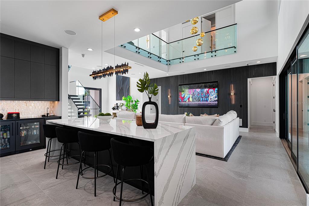 2519 North Riverside Drive Tampa, FL 33602 - Photo 19 of 34 a living room with furniture a flat screen tv and a fireplace