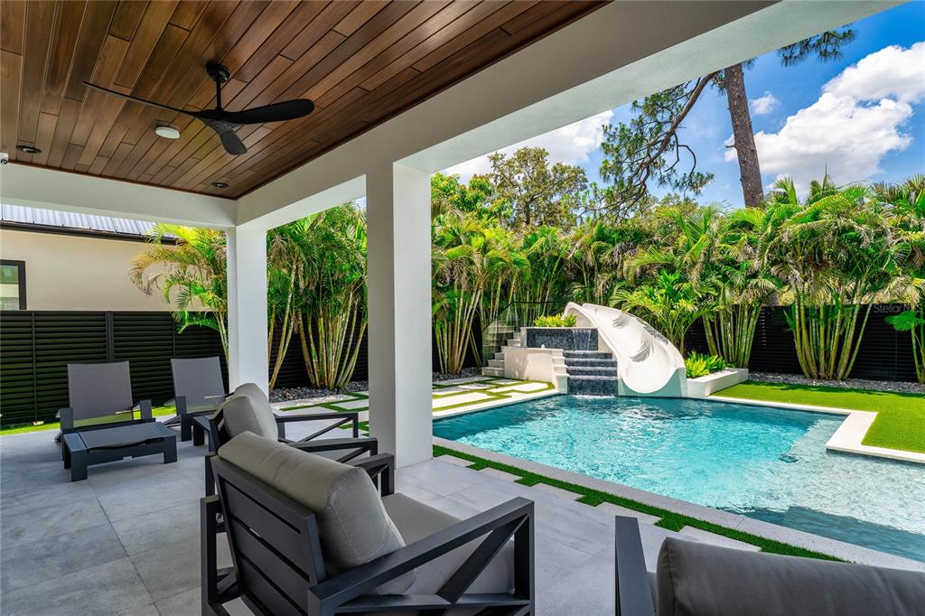 2519 North Riverside Drive Tampa, FL 33602 - Photo 30 of 34 a view of a patio with a table chairs and a backyard