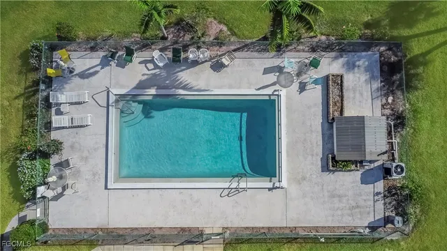 an aerial view of a house with a yard and garden
