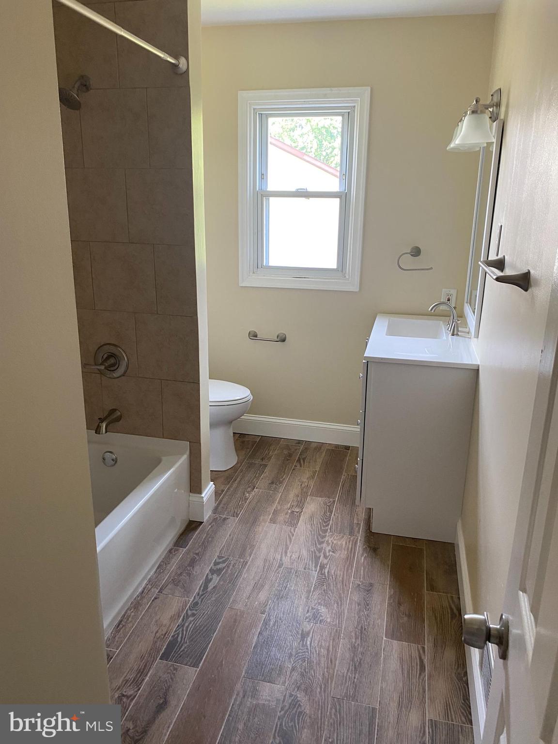 136-138 Reeger Avenue Hamilton, NJ 08610 - Photo 12 of 18 a bathroom with a sink a toilet and bathtub