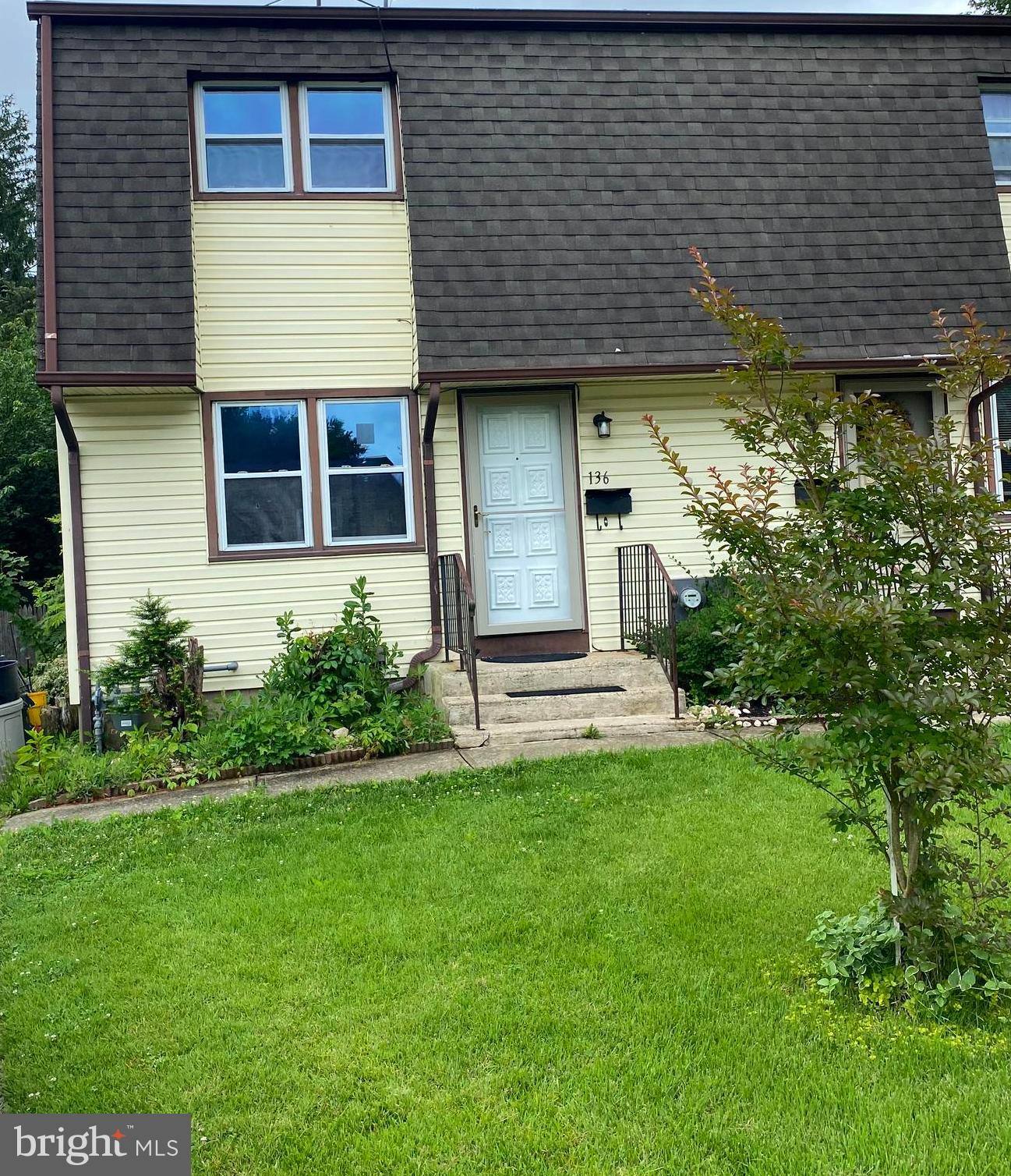 136-138 Reeger Avenue Hamilton, NJ 08610 - Photo 2 of 18 a front view of a house with a garden