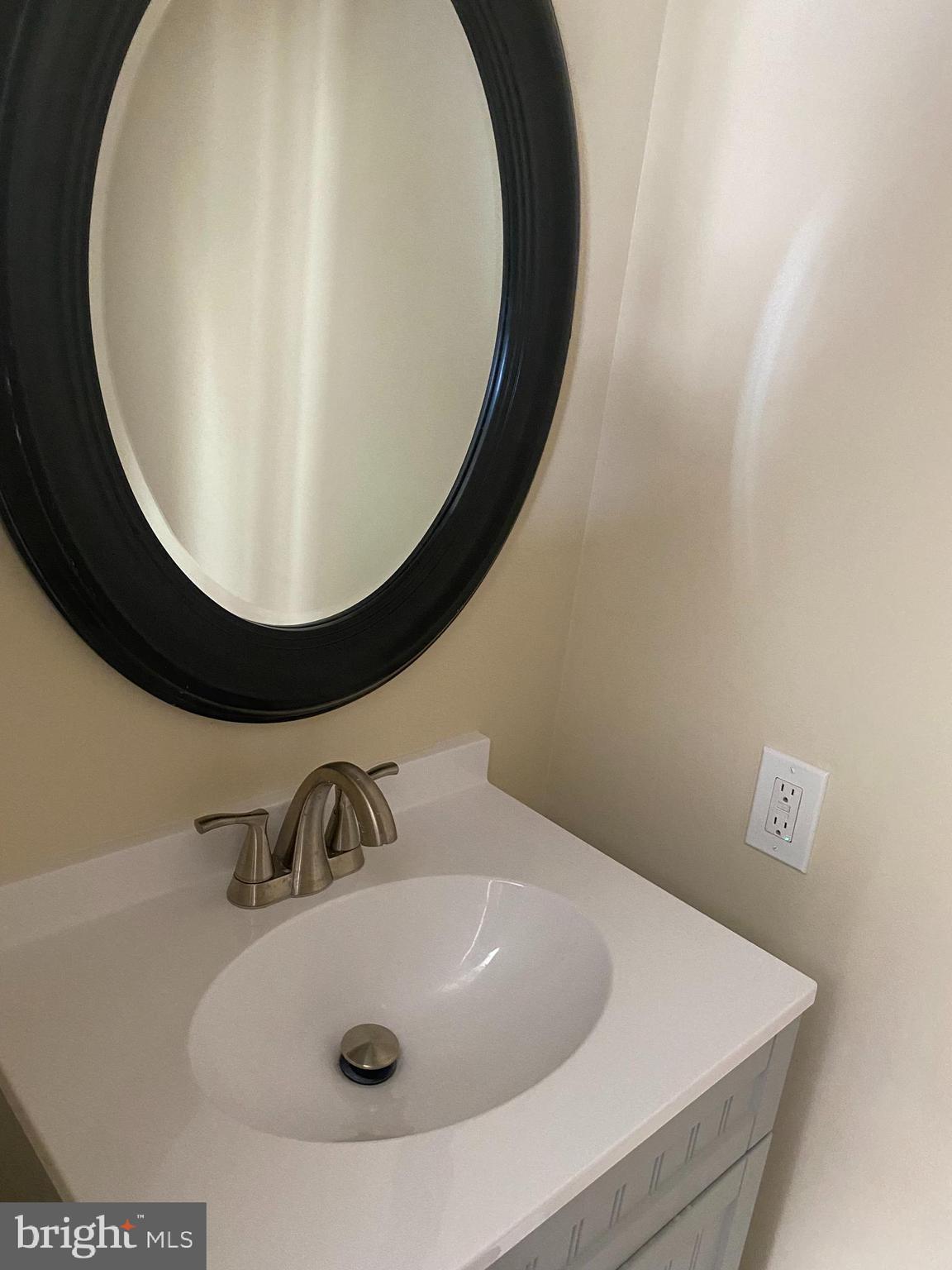 136-138 Reeger Avenue Hamilton, NJ 08610 - Photo 7 of 18 closeup of a sink with a mirror