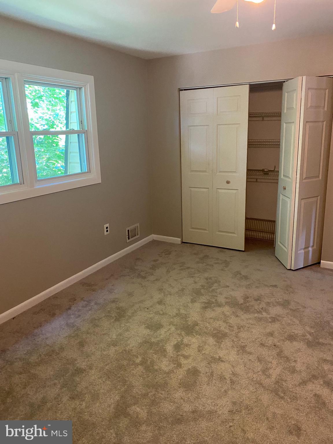 136-138 Reeger Avenue Hamilton, NJ 08610 - Photo 10 of 18 an empty room with closet and windows