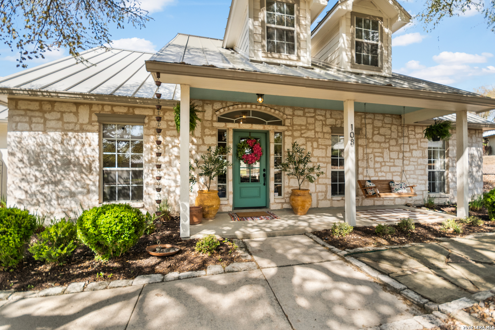 108 Jackrabbit Circle Boerne, TX 78006 - Photo 12 of 50 a front view of a building with glass windows and brick walls