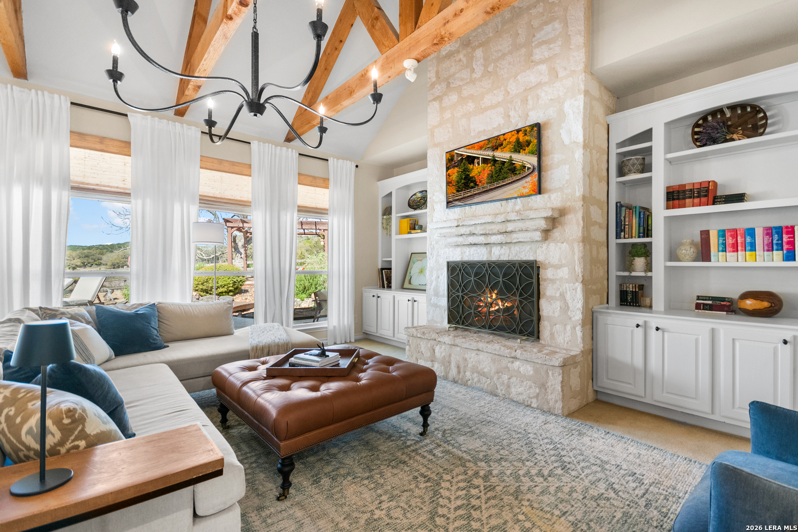 108 Jackrabbit Circle Boerne, TX 78006 - Photo 19 of 50 a living room with furniture fireplace and a large window