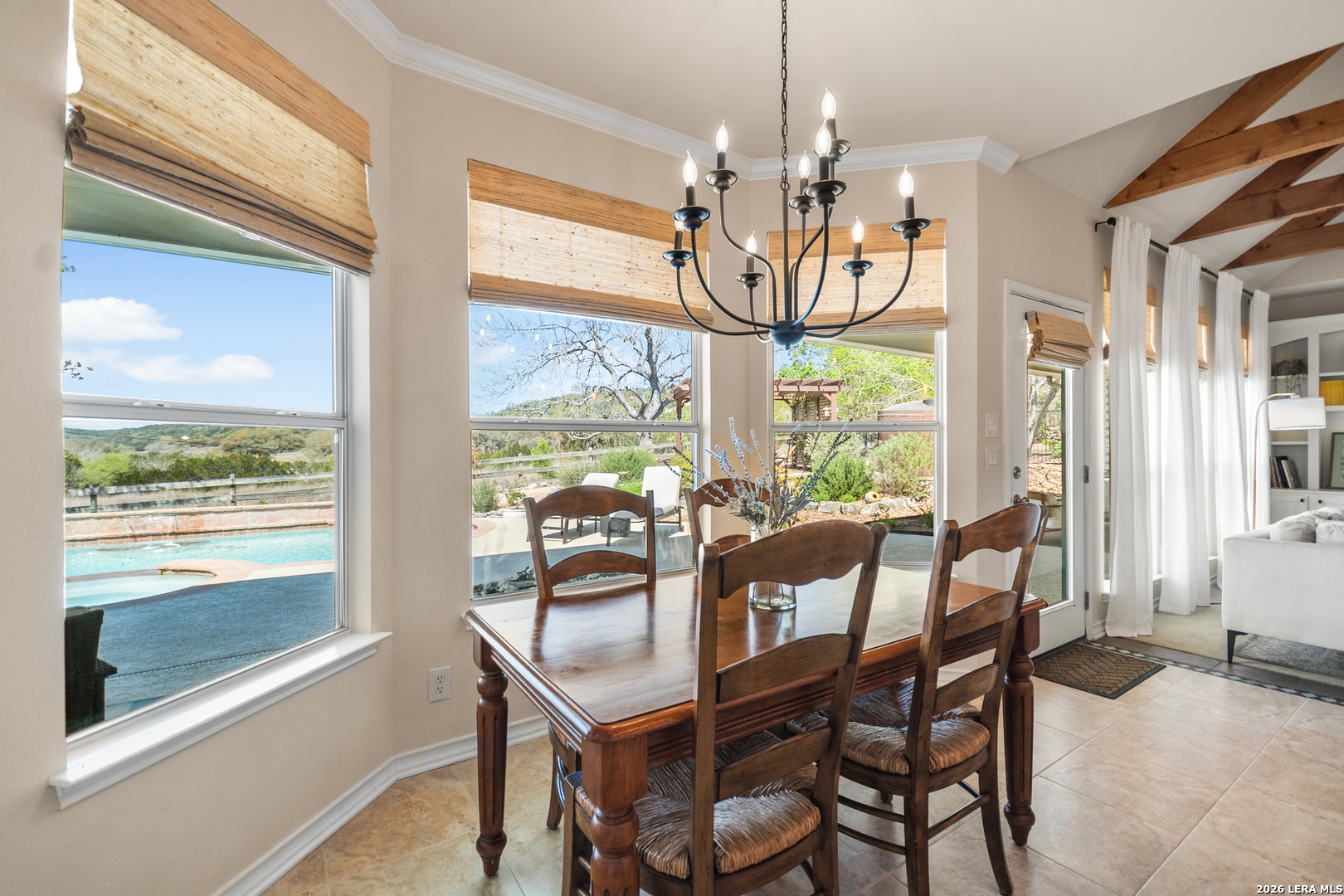 108 Jackrabbit Circle Boerne, TX 78006 - Photo 26 of 50 a view of a dining room with furniture large windows and wooden floor