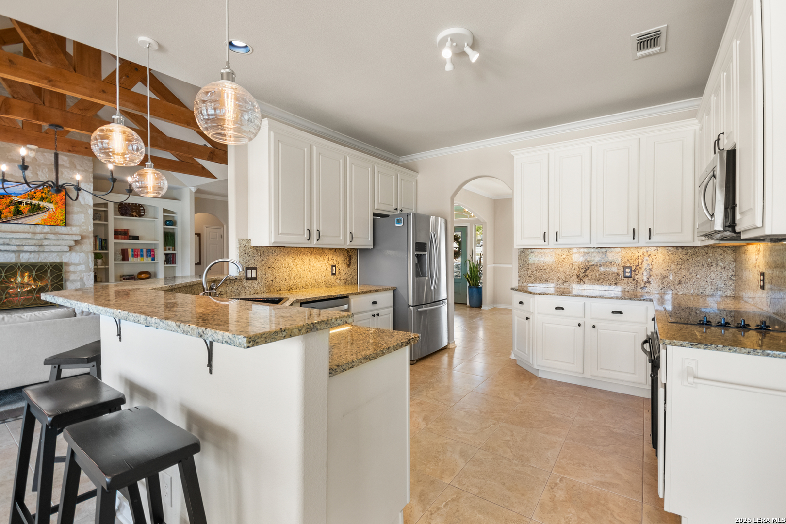 108 Jackrabbit Circle Boerne, TX 78006 - Photo 27 of 50 a kitchen with granite countertop white cabinets and white appliances