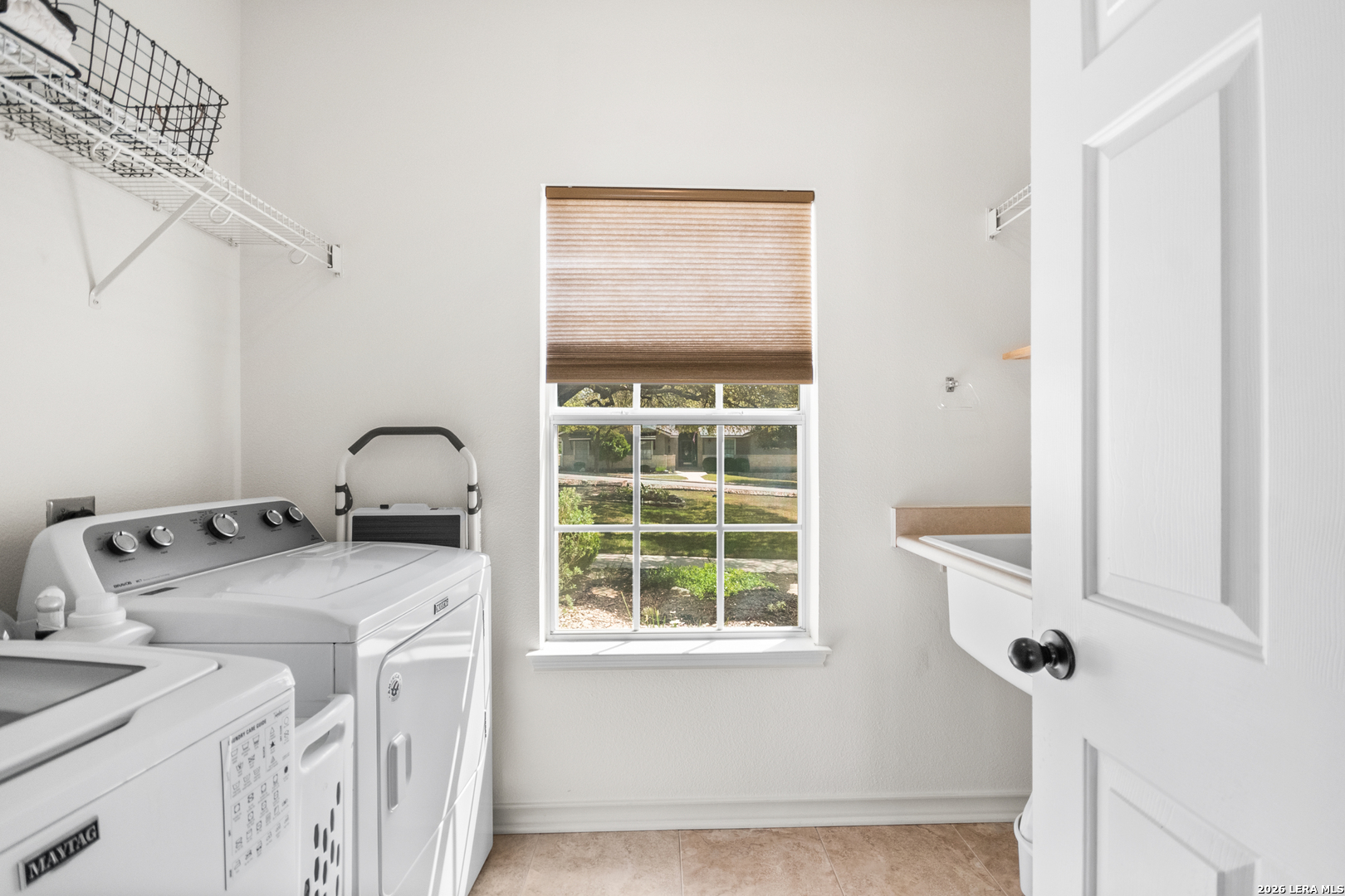 108 Jackrabbit Circle Boerne, TX 78006 - Photo 29 of 50 a utility room with dryer and washer