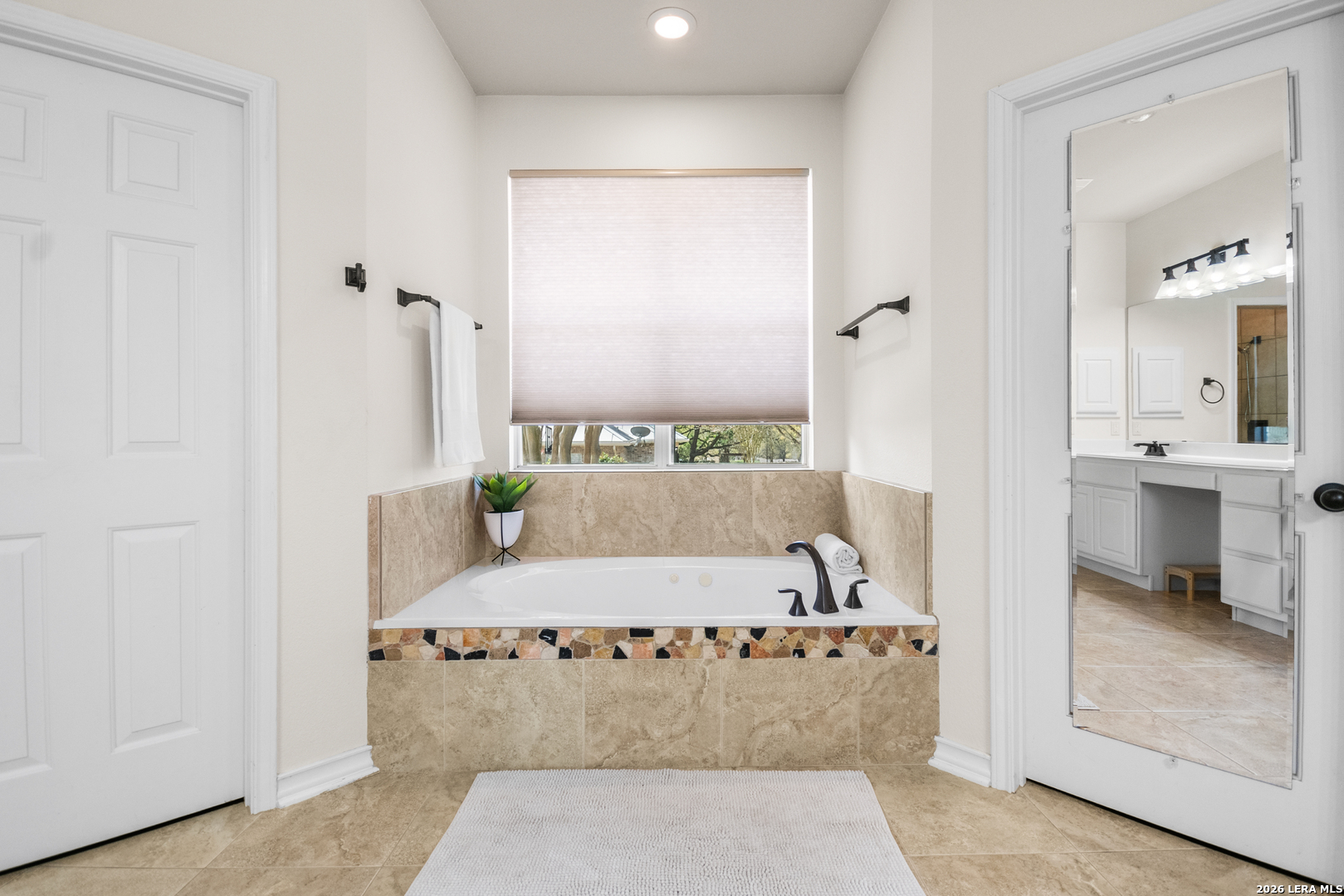 108 Jackrabbit Circle Boerne, TX 78006 - Photo 33 of 50 a bathroom with a bathtub and a shower