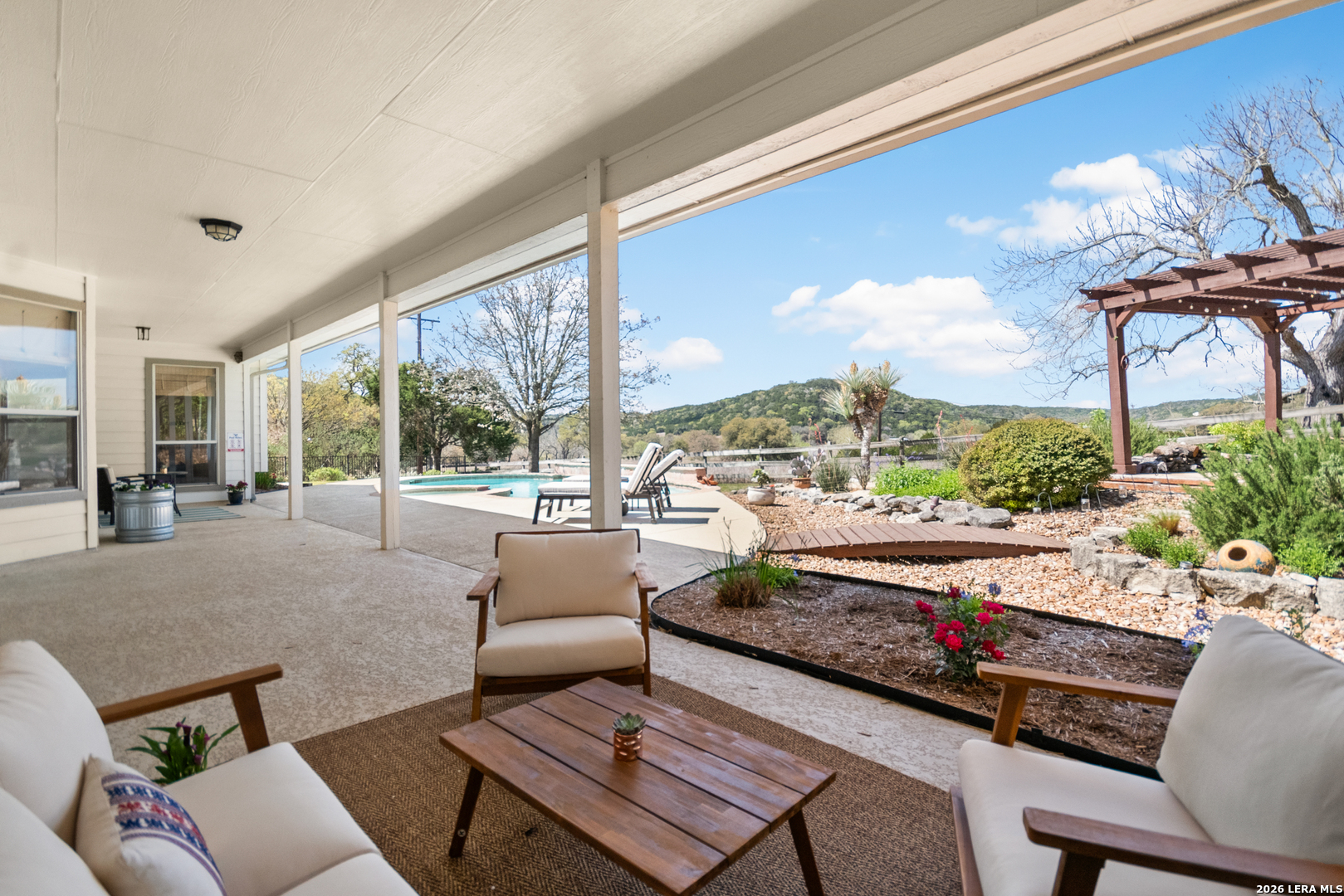 108 Jackrabbit Circle Boerne, TX 78006 - Photo 39 of 50 a living room with furniture and a floor to ceiling window