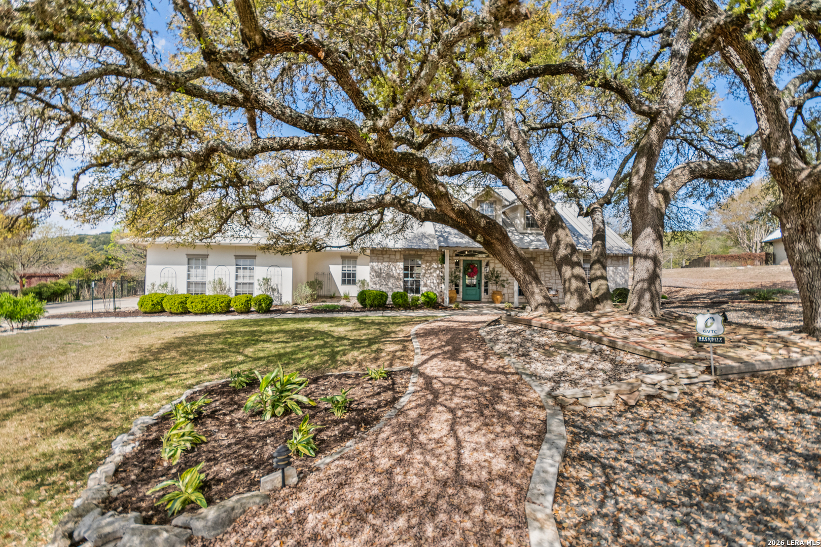 108 Jackrabbit Circle Boerne, TX 78006 - Photo 8 of 50 a view of a large trees in front of a house