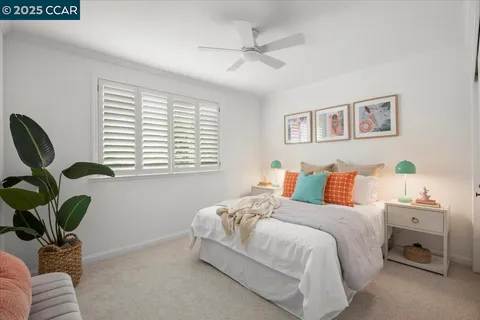 a bedroom with a bed and a couch