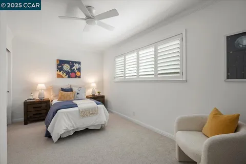 a bedroom with a bed and a couch