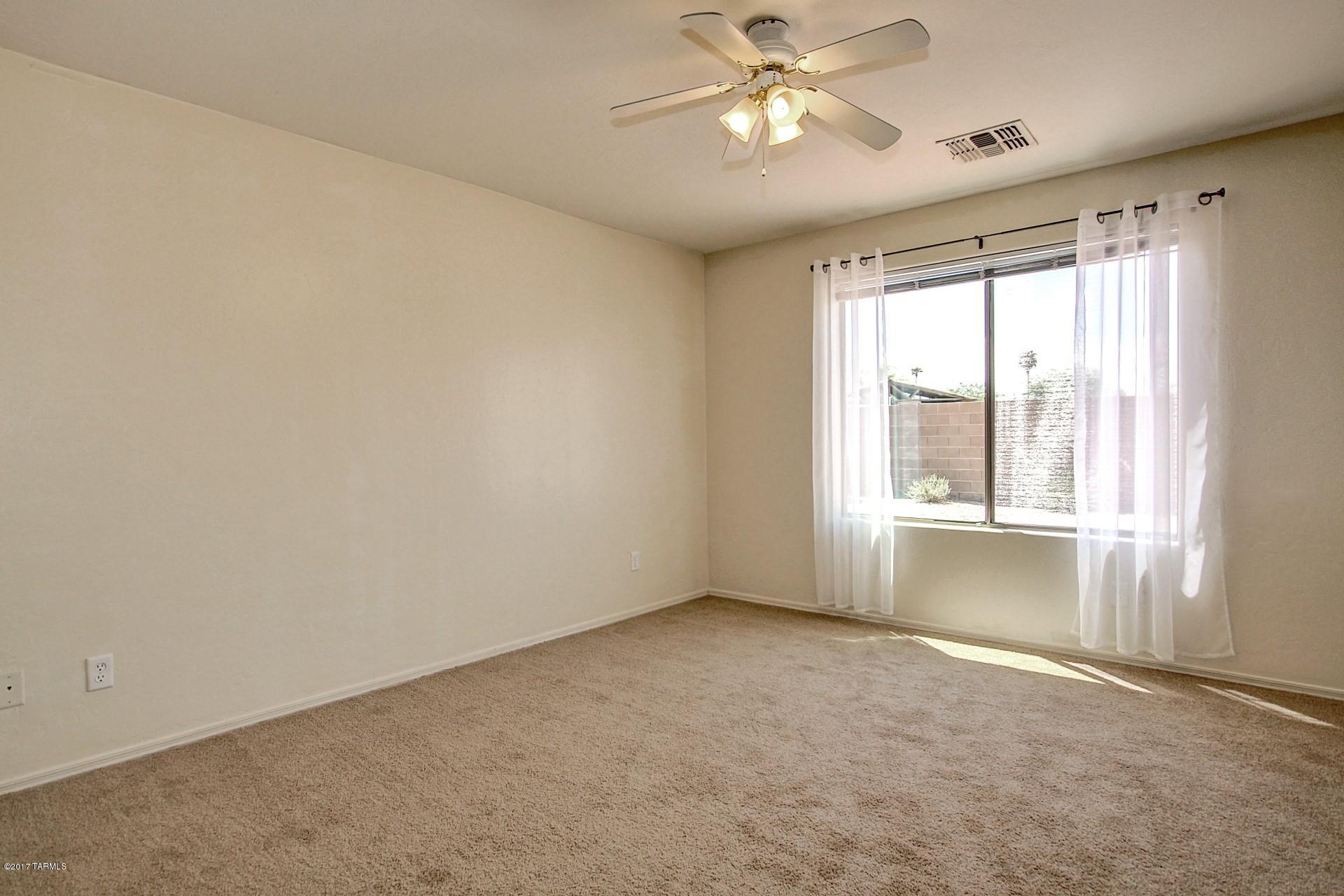 8350 East Bowline Road Tucson, AZ 85710 - Photo 11 of 26 a view of an empty room with a window