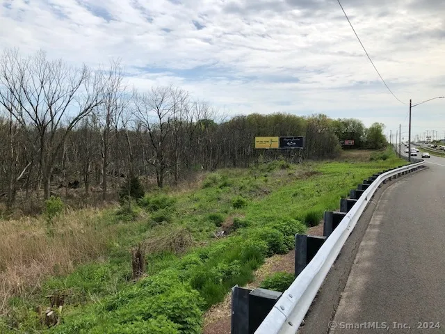 a view of a garden with a building in the background