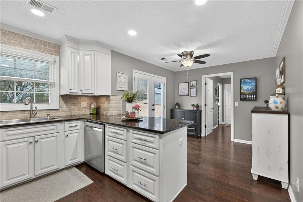 15 Bluegrass Cove Northeast Cartersville, GA 30121 - Photo 12 of 51 a kitchen with white cabinets and sink