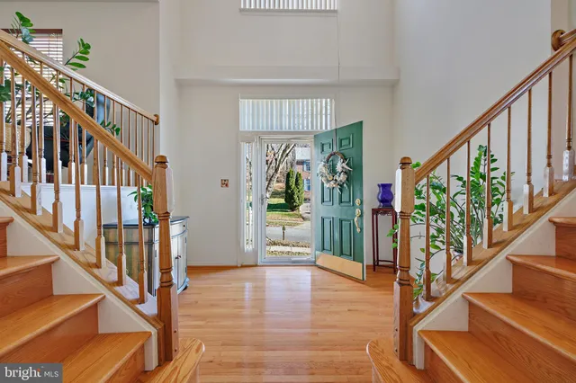 a view of an entryway with wooden floor and windows