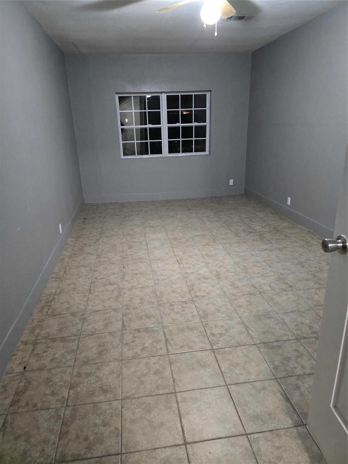 9938 Kittrell Street Houston, TX 77034 - Photo 11 of 12 a view of an empty room with a window