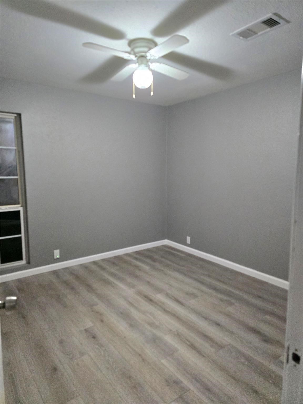 9938 Kittrell Street Houston, TX 77034 - Photo 10 of 12 wooden floor in an empty room