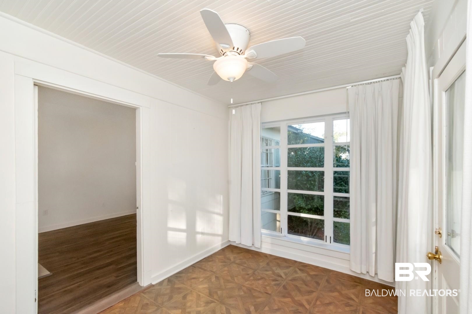 16 Princess Anne Road Mobile, AL 36608 - Photo 20 of 40 Empty room with parquet floors and a ceiling fan