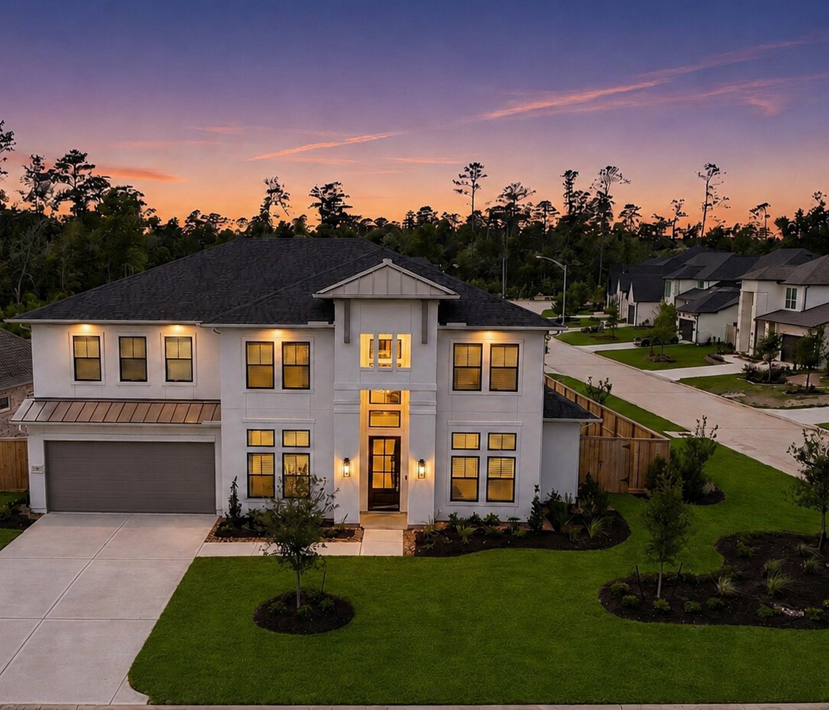 416 Venado View Court Conroe, TX 77304 - Photo 1 of 34 Striking modern exterior with elegant architectural lines, enhanced by professional landscape design and stunning twilight ambiance.