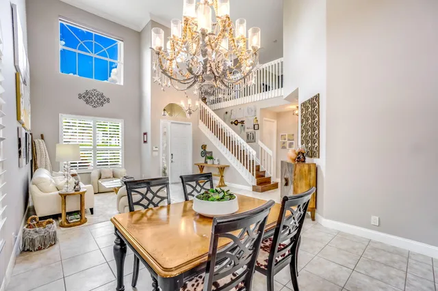 a view of a hallway with wooden floor and windows