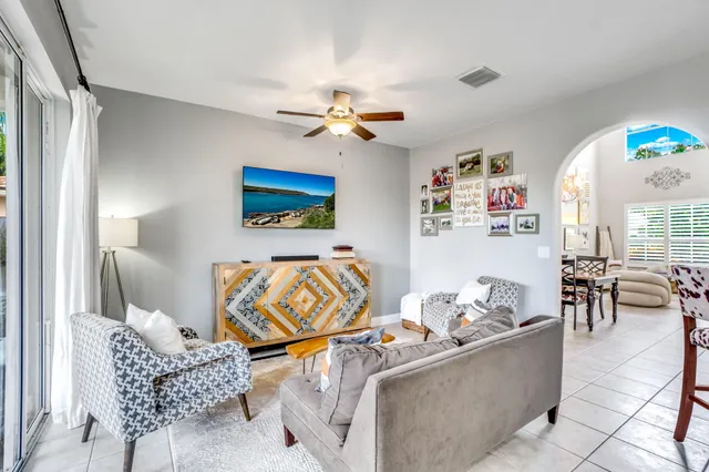 a balcony with furniture and a potted plant