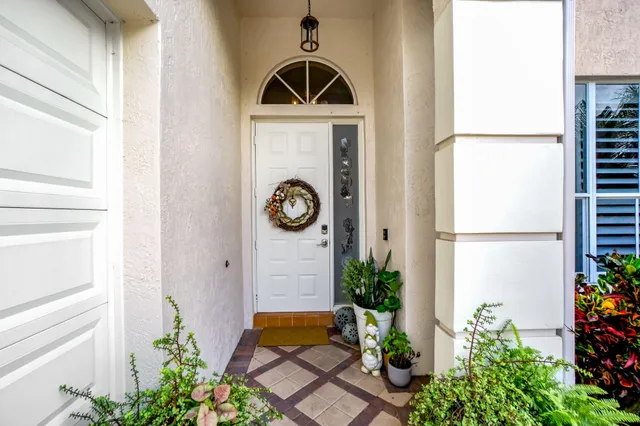 a dining room with furniture and a chandelier