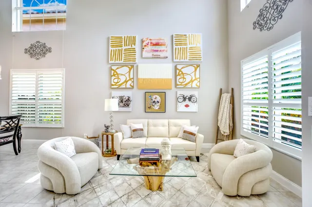a kitchen with stainless steel appliances granite countertop a sink and a refrigerator