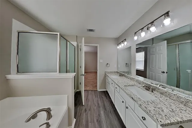 a view of an empty room with a ceiling fan