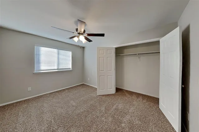 a bathroom with a bathtub and a window