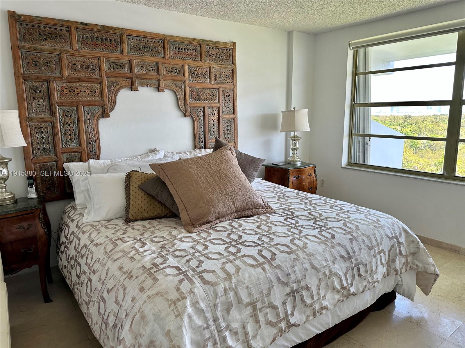 199 Ocean Ln Drive, Unit 1004 Key Biscayne, FL 33149 - Photo 6 of 12 a bedroom with a large bed and a window