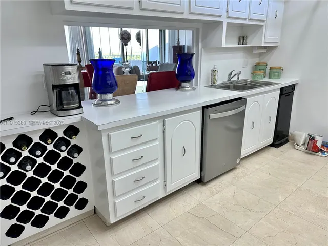 a kitchen with a sink and cabinets
