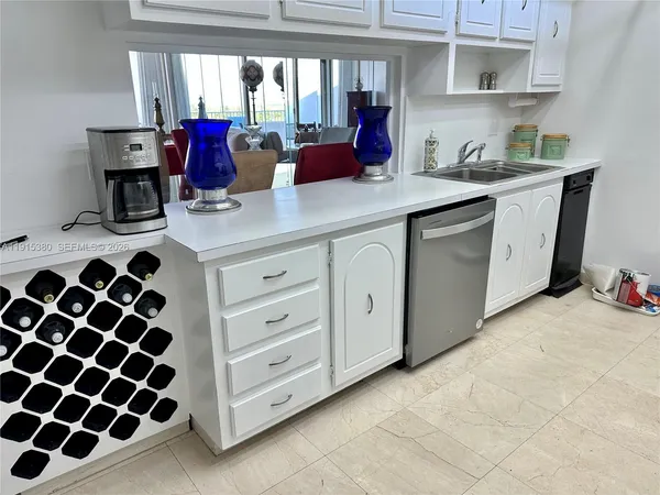 a kitchen with a sink and cabinets